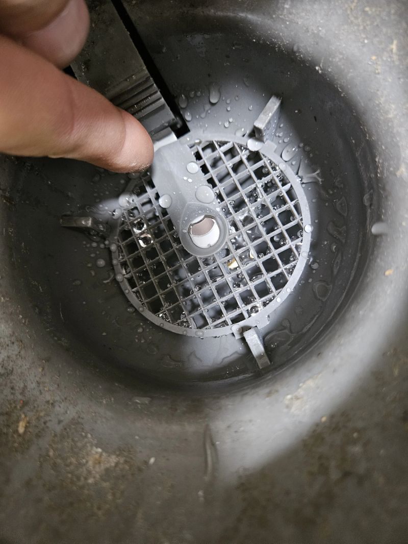 Checking a solid feeder spray pattern on a service call, Hoffman Water