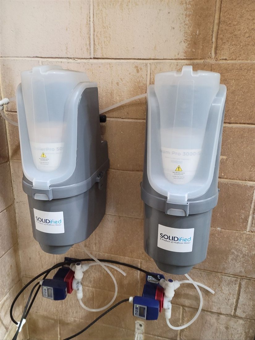 SOLIDified dispensers, a product of Hoffman Water, installed with automated feed pumps